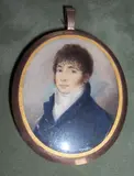 Attributed to Charles G. Dillon, A Gentleman, wearing blue coat with gold buttons over white waistcoat and tied stock, yellow metal oval frame, the rear with initials 'WW' and plaited hair,