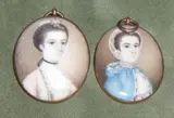 English School, A near pair of Ladies, one wearing pink dress with black ribbon choker, the other wearing blue dress with white cap, yellow metal oval frames, with mother of pearl backs, the largest