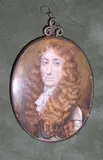 A Gentleman, wearing armour over tied white cravat, his curled brown periwig worn long. by Circle of Richard Gibson, Watercolour on vellum, gilt-metal frame, sold Sep 2020