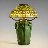 George P. Kendrick and Tiffany Studios, Rare table lamp, c. 1905, glazed earthenware, leaded slag glass, patinated bronze