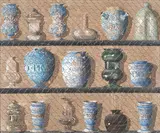 Continental School, Ceramics and glassware in a cabinet
