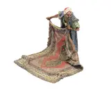 Frans Xaver Bergman, cold painted bronze figure of a middle eastern carpet seller, cold painted bronze