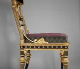 Theophilus Edvard von Hansen, Laufsessel aus dem Schloß Hernstein in Niederösterreich, Um 1870, Buche, massiv, geschnitzt, schwarz gefaßt, vergoldet - Hoftischlermeister Heinrich Dübell (1812–1886), Wien / originale Stoffbespannung mit rotem Rips mit Silberfäden