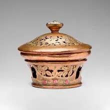 attribution Edward Spencer, Covered potpourri bowl on stand with pierced and engraved foliate decoration, c. 1910, handwrought copper, enamel