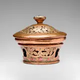 attribution Edward Spencer, Covered potpourri bowl on stand with pierced and engraved foliate decoration, c. 1910, handwrought copper, enamel