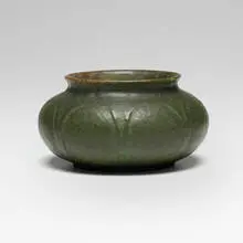 Low vase with leaves by Grueby Faience Company, sold Sep 2026