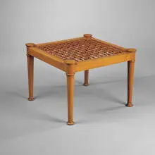 Diphros stool by T. H. Robsjohn-Gibbings, 1961, Greek walnut, leather, sold Oct 2001