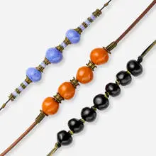 Doyle Lane, Collection of three necklaces, c. 1978-2000, leather, cloth, metal, glazed ceramic