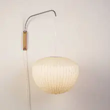 Bubble lamp by George Nelson, fiberglass, aluminum, walnut, sold Oct 2001