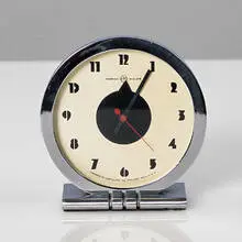 Gilbert Rohde, table clock, 1930s, chrome-plated and enameled metal
