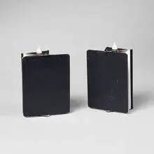 sconces, pair by Charlotte Perriand, enameled metal, sold Oct 2001