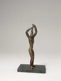 Haarflechtende Frau by Renée Sintenis, 1917, Bronze mit gelbbrauner Patina, nachträglich auf schwarzen Steinsockel montiert, sold May 2019