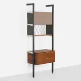 CSS (Comprehensive Shelving System) by George Nelson & Associates, 1959, enameled aluminum, walnut, lacquered Masonite, aluminum, Alexander Girard Checkers fabric, enameled steel, sold Mar 2025