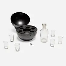 Portable bar by Marianne Brandt, c. 1930, enameled steel, glass, sold Mar 2025