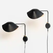 Antony sconces, pair by Serge Mouille, c. 1950, enameled aluminum, enameled steel, brass, sold Mar 2025