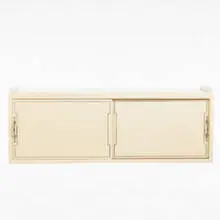 hanging cabinet by Tommi Parzinger, 1960s, lacquered wood, silverplate, sold Jun 2001