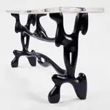 Paul Laszlo, console, 1953, ebonized wood, lucite