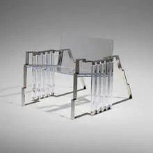 Bolt chair (from the Tumbling Block Line) by Charles Hollis Jones, c. 2014, Lucite, polished nickel-plated steel, sold Sep 2024