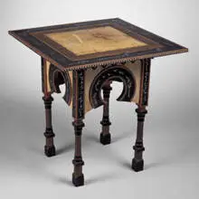 card table by Carlo Bugatti, c. 1895, inlaid wood, parchment, copper, sold Jun 2001