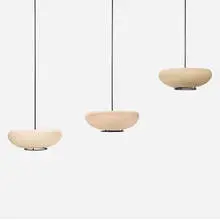 Hanging planters, set of three by John Follis and Rex Goode, 1949, stoneware, wrought iron, sold Sep 2024