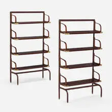 Bookshelves, pair by attribution Jacques Adnet, c.1955, leatherette over wood and steel, brass, sold Jul 2024