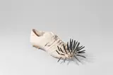 Uecker - Schuh by Günther Uecker und Ypsilon Fongi, 1972, Gips, Nägel, sold May 2021