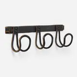 attribution Jacques Adnet, Coat rack, c. 1955, saddle-stitched leather over steel