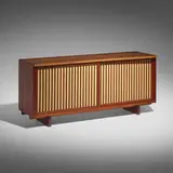 Cabinet by George Nakashima, 1957, walnut, pandanus cloth, sold Feb 2024