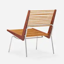 Lounge chair by Maurice Martiné, c. 1948, walnut, hickory, aluminum, sold Nov 2023