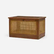 Linen chest from Hostel for Girls, Punjab University, Chandigarh by Pierre Jeanneret, c. 1958, teak, cane, steel, sold Aug 2026
