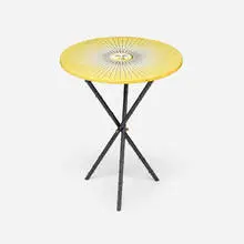 Sun occasional table by Piero Fornasetti, 1991, screenprint on lacquered wood, rubberized steel, sold Aug 2026