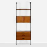 CSS (Comprehensive Shelving System) by George Nelson & Associates, 1959, walnut, brushed and enameled aluminum, laminate, lacquered Masonite, enameled steel, sold Aug 2026