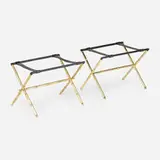 Jacques Adnet, Luggage stands, pair, c. 1950, brass-plated steel, saddle-stitched leather