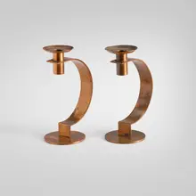 Albert Reimann, Crescent candlesticks model 21008, pair, 1933, copper-plated brass