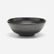 Black bowl by David Cressey, c. 1960, glazed stoneware, sold Jul 2023