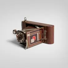 Walter Dorwin Teague, Kodak camera, model 1A, c. 1930, gilt, chrome-plated and enameled metal, wood, camera, leather