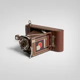 Walter Dorwin Teague, Kodak camera, model 1A, c. 1930, gilt, chrome-plated and enameled metal, wood, camera, leather