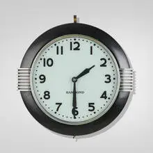 Hammond Instrument Co., Wall clock, model 341, c. 1935, chrome-plated steel, enameled steel, glass, lacquered wood