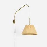 Finnish, Articulated wall lamp, c. 1955, brass, cane shade