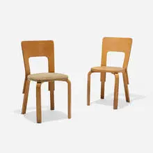 Dining chairs model 66, pair by Alvar Aalto, c. 1932, birch plywood, laminated birch, upholstery, sold Aug 2026