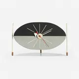 Watermelon table clock, model 2219A by George Nelson & Associates, 1954, lacquered wood, enameled aluminum, enameled steel, rubber, sold Nov 2022
