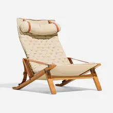 Lounge chair by Preben Fabricius and Jørgen Kastholm, c. 1965, oak, brass, upholstery, leather, sold Aug 2026