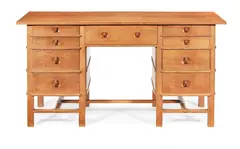 Peter van der Waals, A Dressing Table, circa 1930, a quarter-sawn oak with four faceted graduated drawers each side of the central drawer