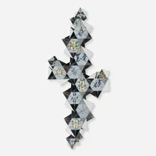 C. Jeré, Prismatic wall sculpture, 1970, polished steel, resin