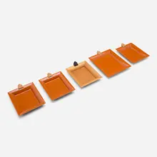 Hermès, Atrium trays, set of five, lacquered wood, fruitwood, leather