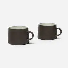 Mugs, pair by Jens Quistgaard, c. 1960, glazed stoneware, sold Jul 2026