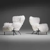 Tre Pezzi lounge chairs, pair by Franco Albini and Franca Helg, c. 1957, enameled steel, sheepskin, sold Mar 2026