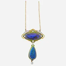 Durand & Co., An oval black opal cabochon, 22.2 x 11.3 x 5.9mm set in shaded translucent green and blue enameled surmount suspends similar pear-shaped black opal cabochon drop