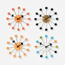 George Nelson & Associates, Ball wall clocks model 4755, set of four, enameled aluminum, lacquered wood, brass
