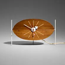 Watermelon table clock, model 2219D by George Nelson & Associates, 1954, walnut, enameled steel and metal, sold Jul 2026